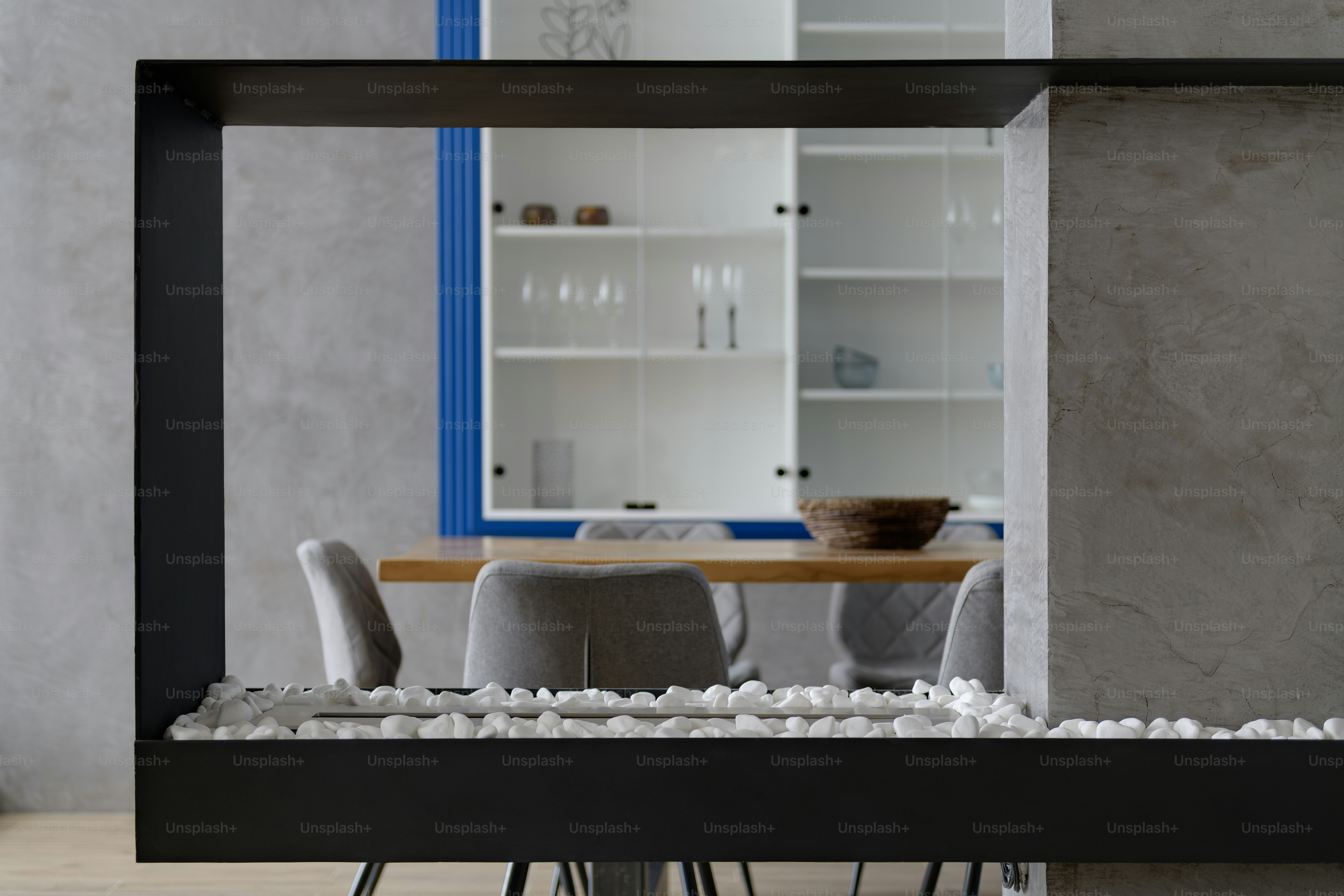 A room with a table and a chair in it photo – Interior design Image on ...