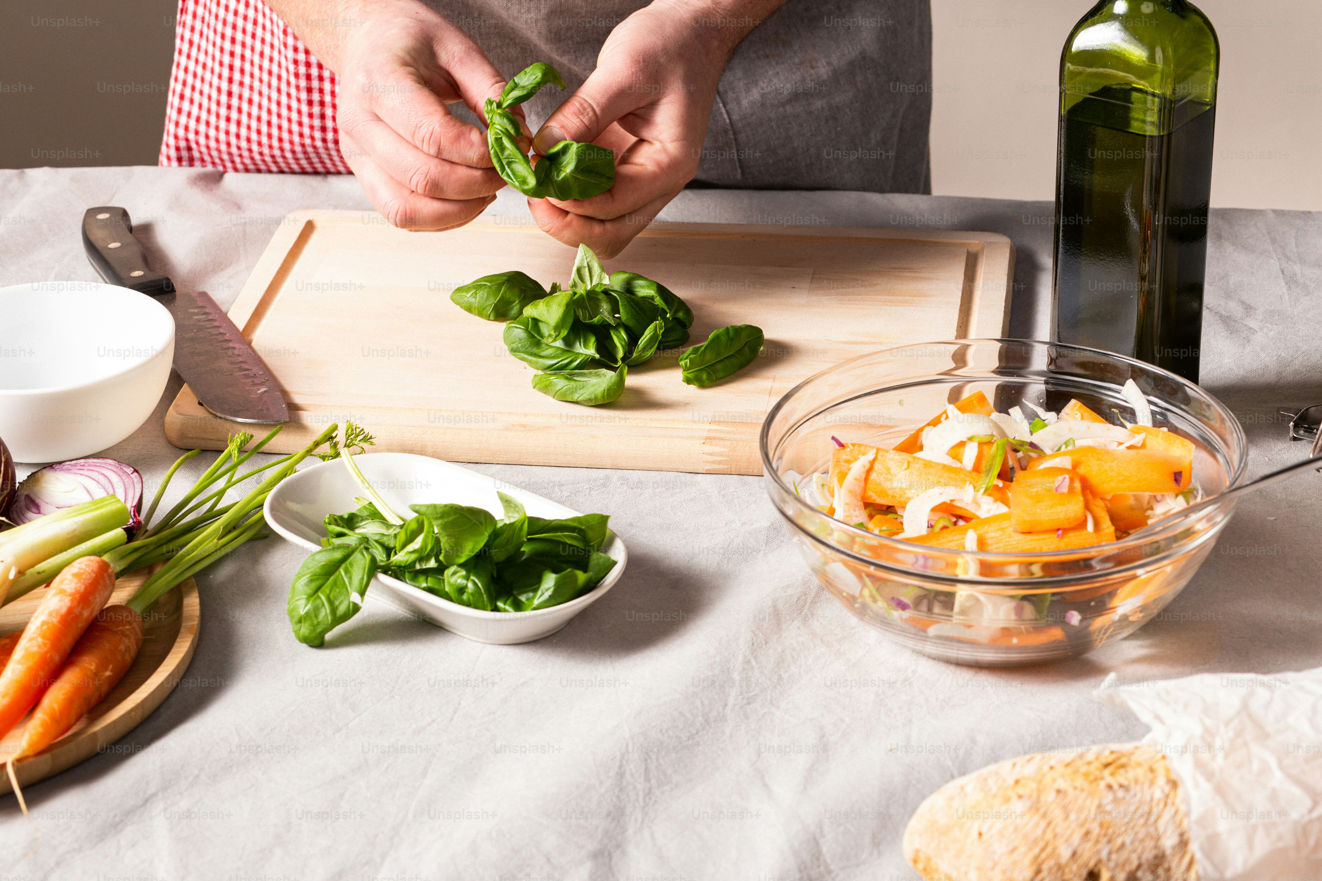 a person preparing food on a cutting board