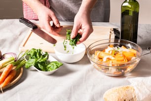 a person preparing food on a cutting board