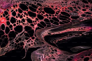 a close up view of a red and black substance