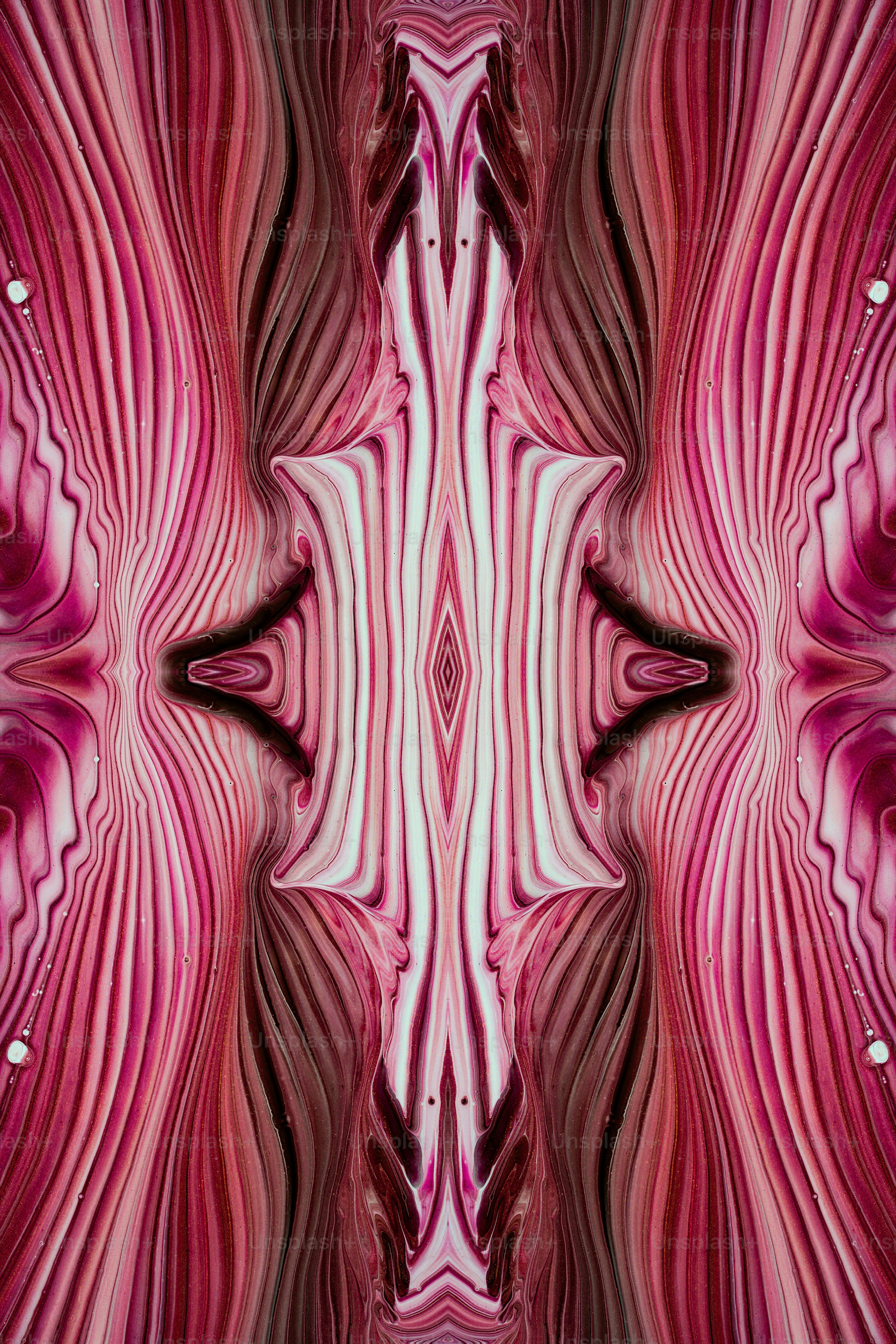 Una imagen abstracta de un patrón rosa y blanco