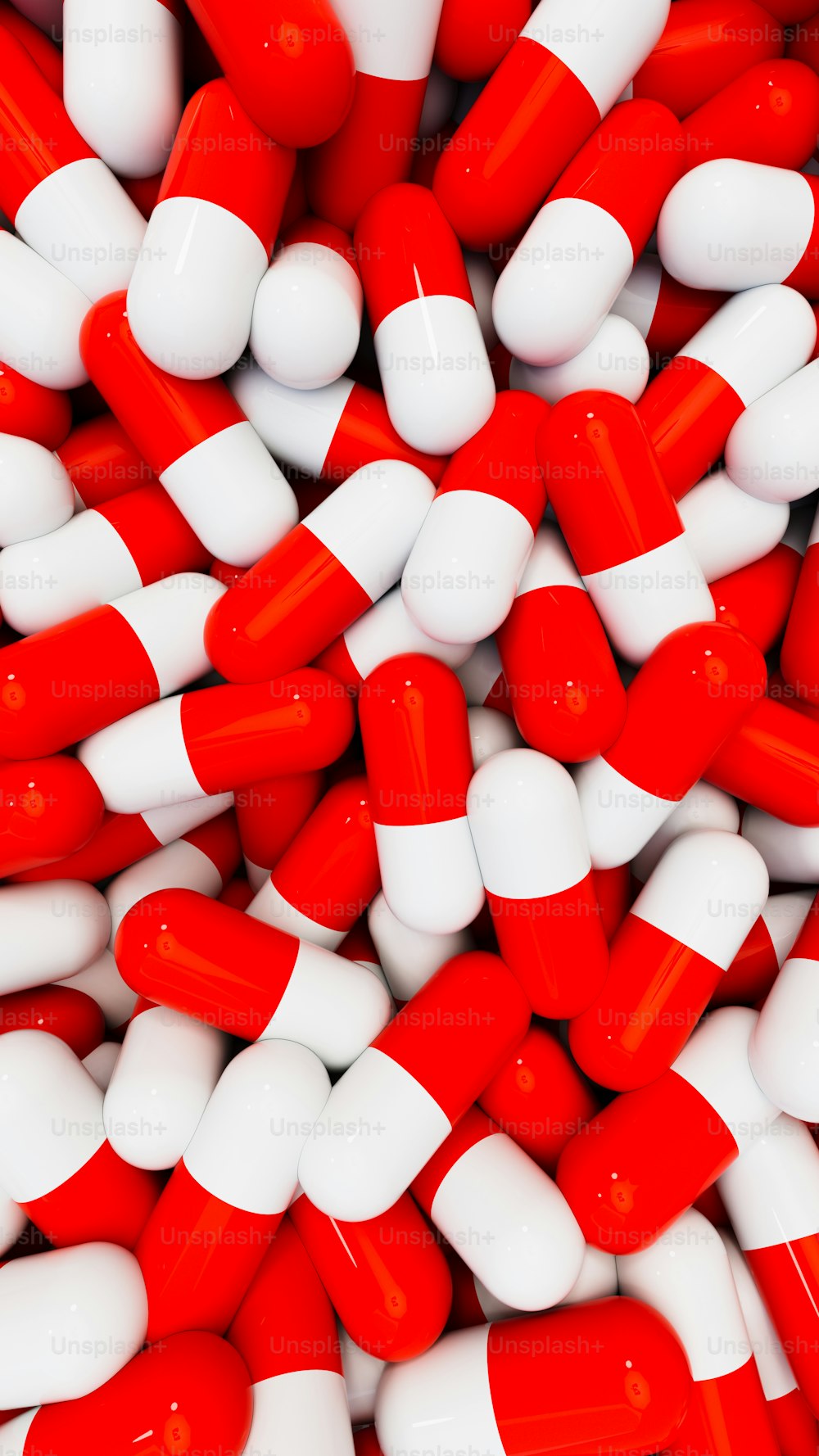 a pile of red and white pills