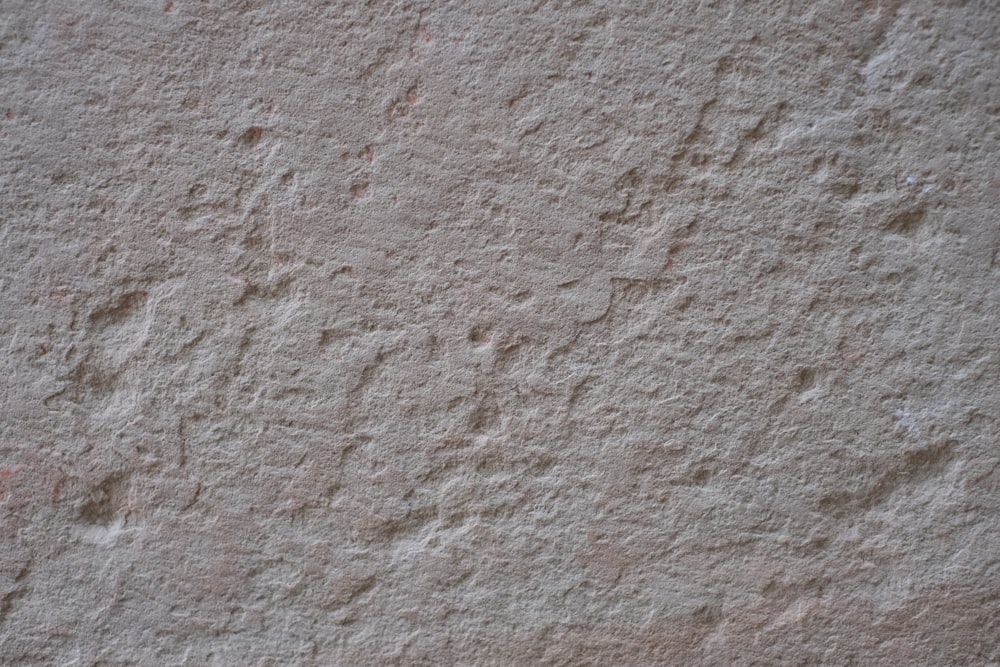 a close up of a white stucco wall