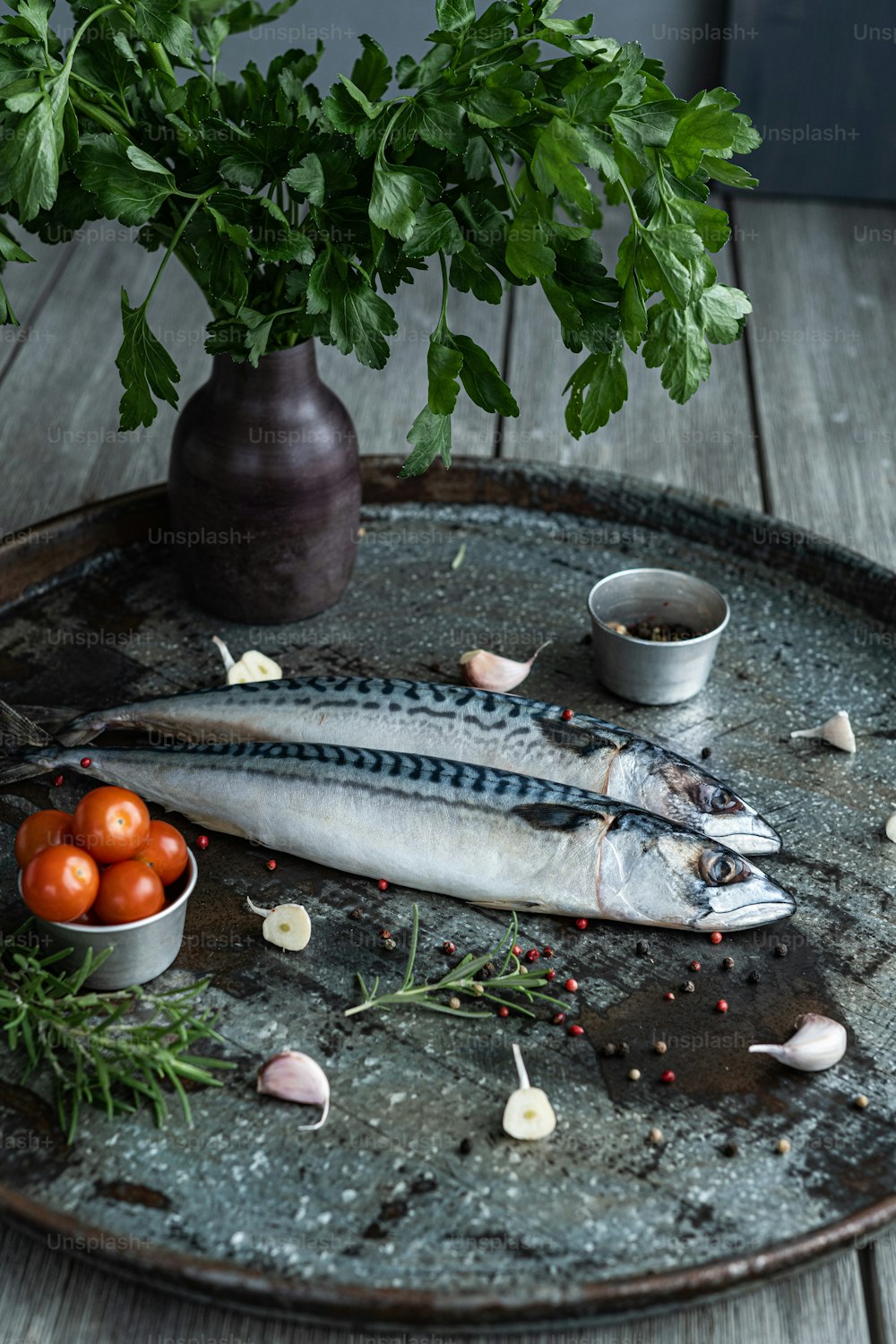 a couple of fish sitting on top of a metal tray