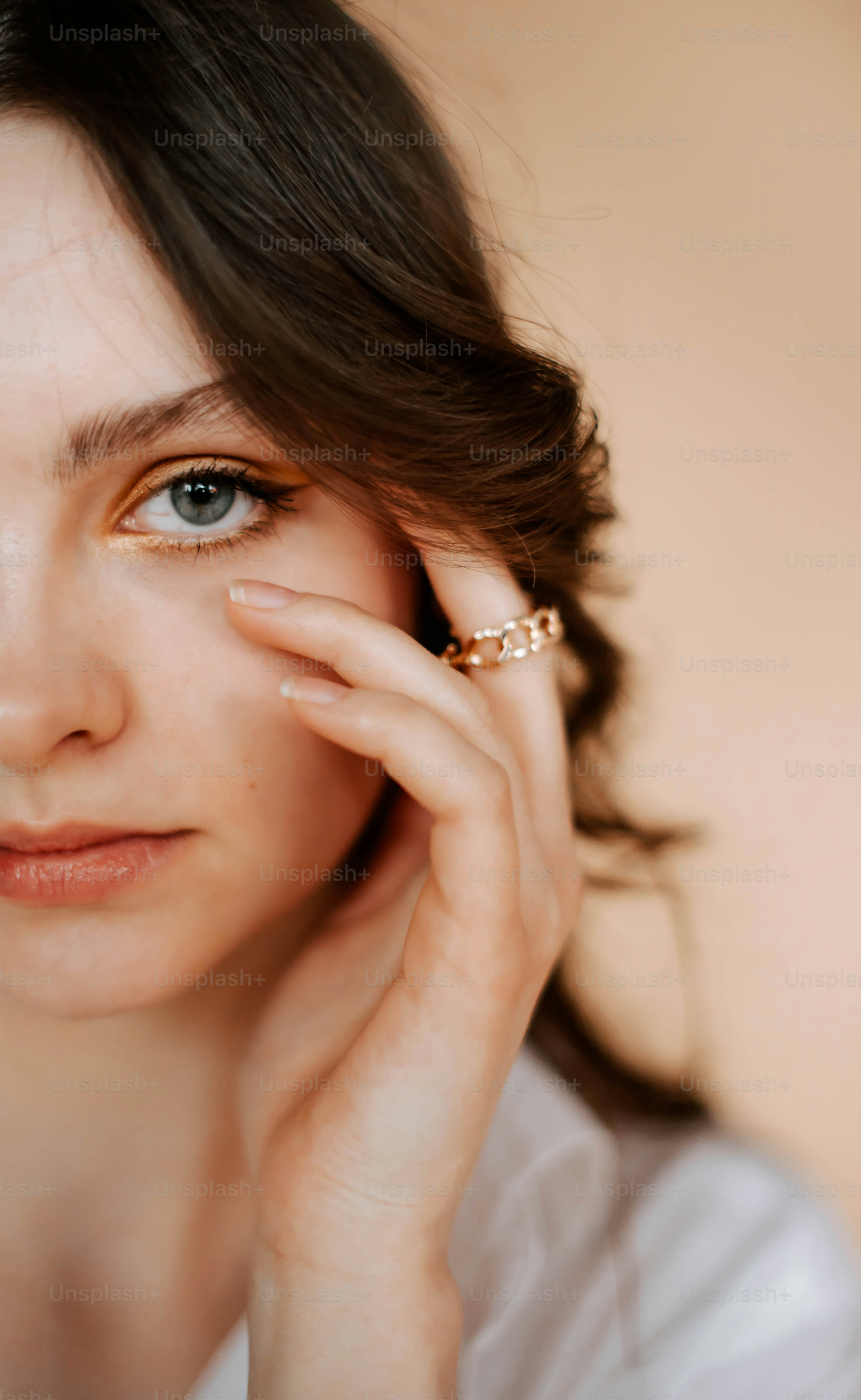a close up of a person with a ring