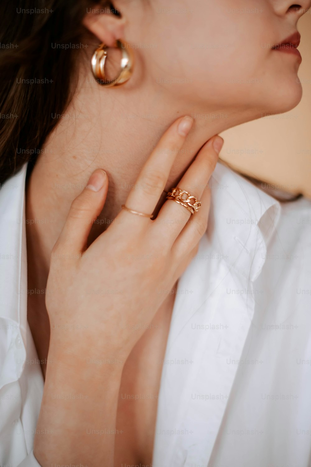 a close up of a person wearing a ring