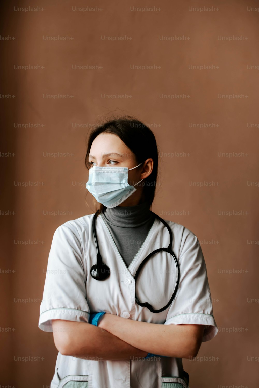 a woman wearing a mask and a stethoscope