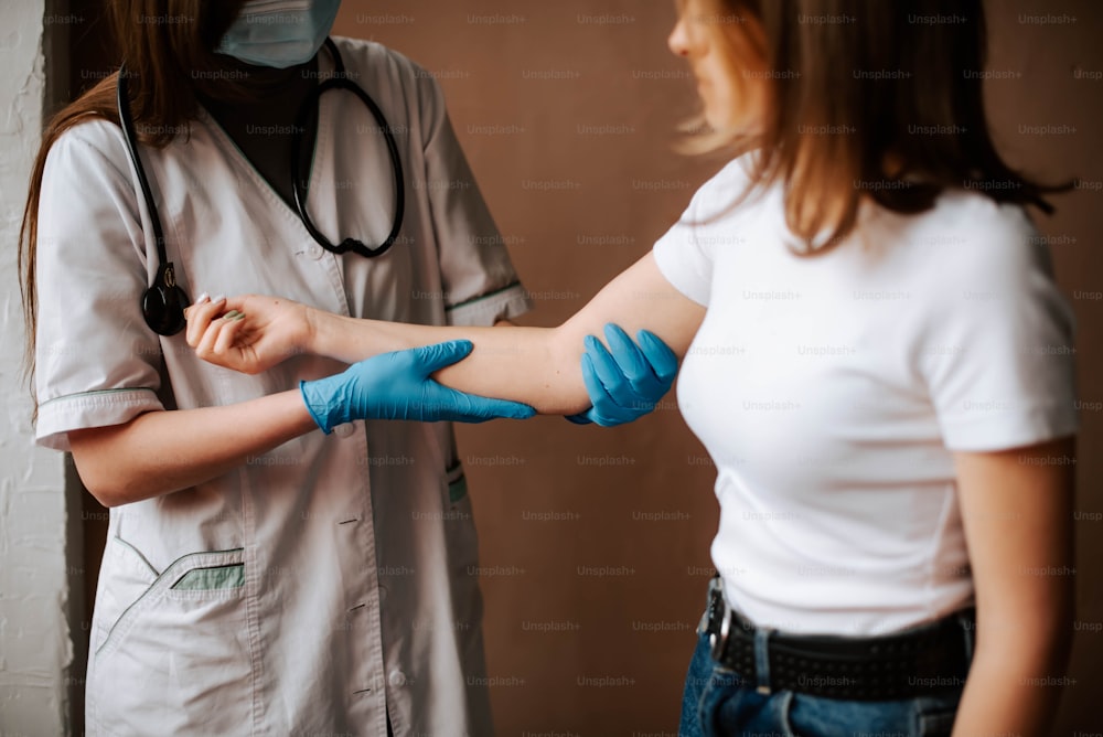 a woman in a white shirt and blue gloves