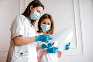 a couple of people wearing masks and gloves