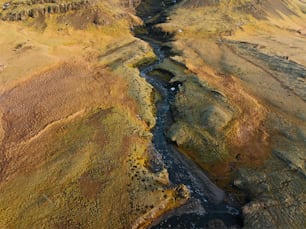 an aerial view of a river running through a valley