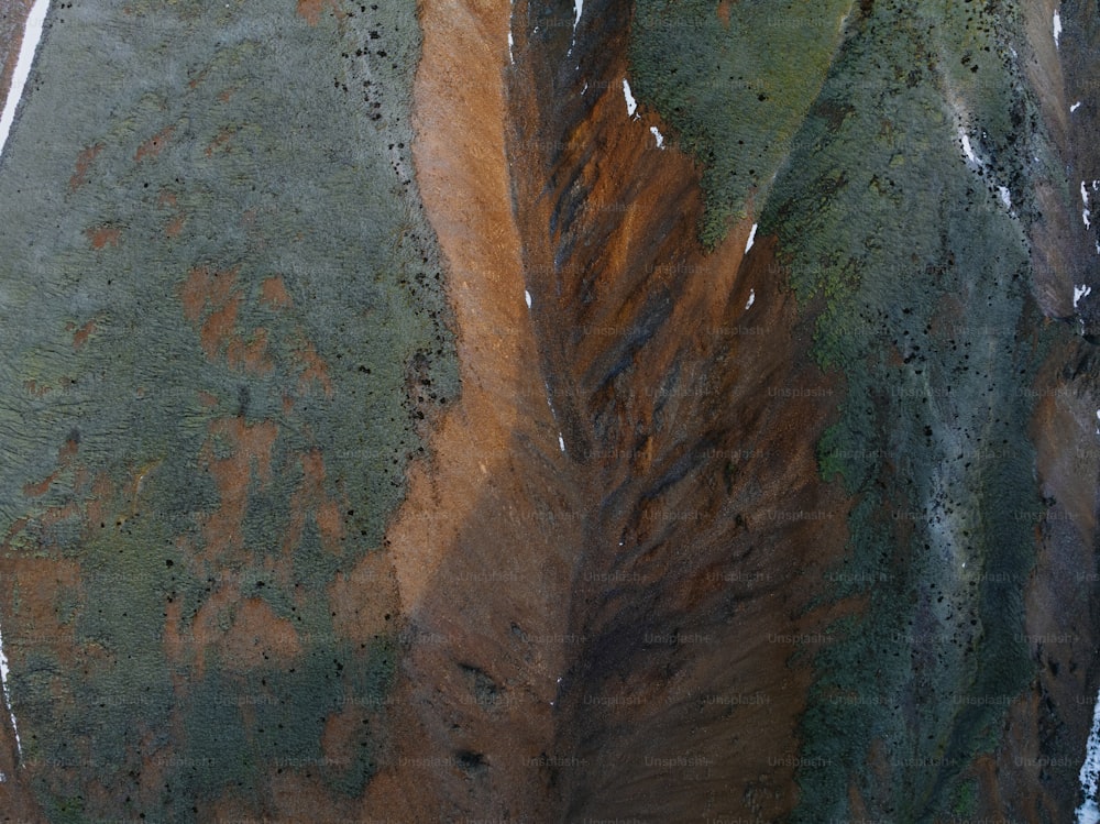 an aerial view of a dirt and grass area