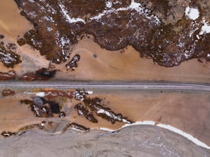 an aerial view of a road in the middle of nowhere