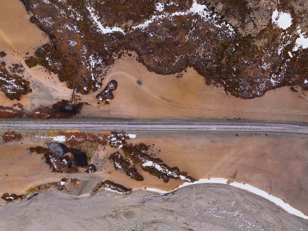an aerial view of a road in the middle of nowhere
