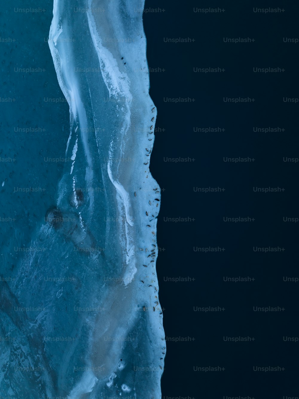 an aerial view of ice and water from above