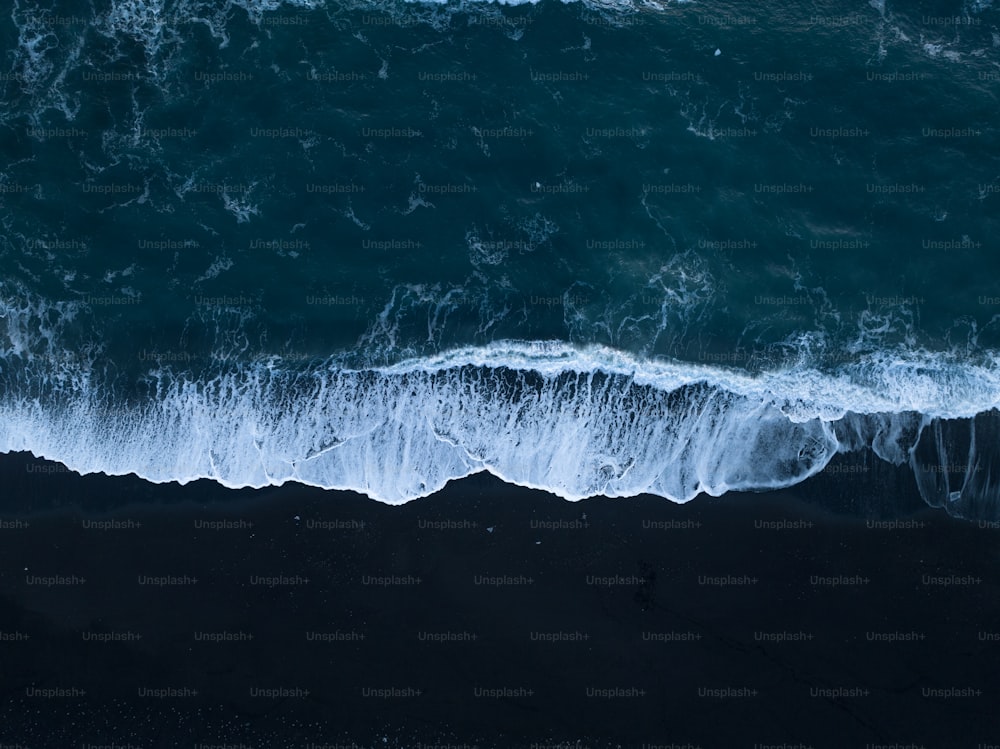 a large body of water with waves coming in and out of it