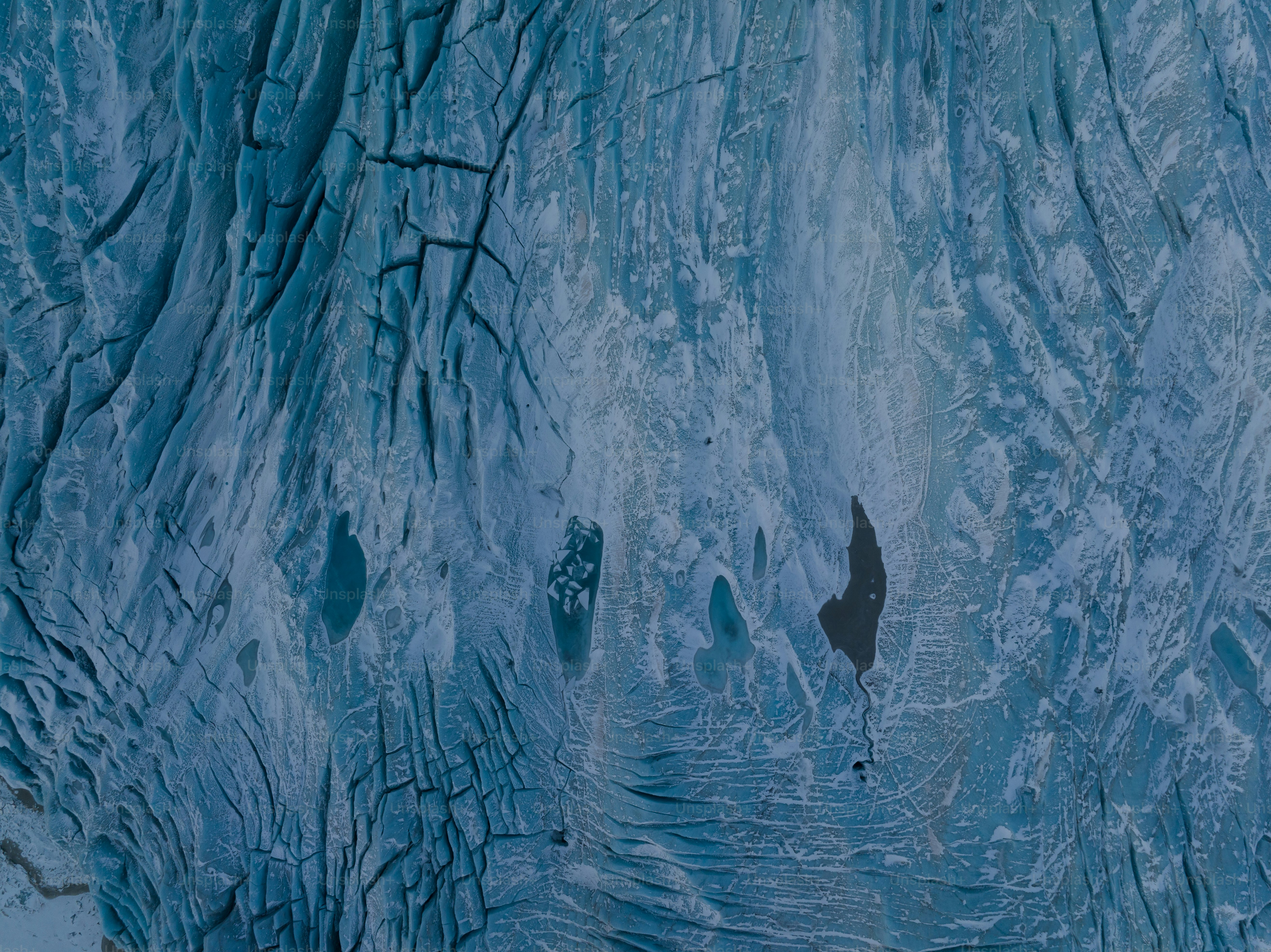 a group of people walking up a snow covered mountain