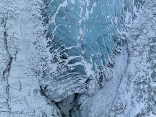 an aerial view of a glacier in the snow