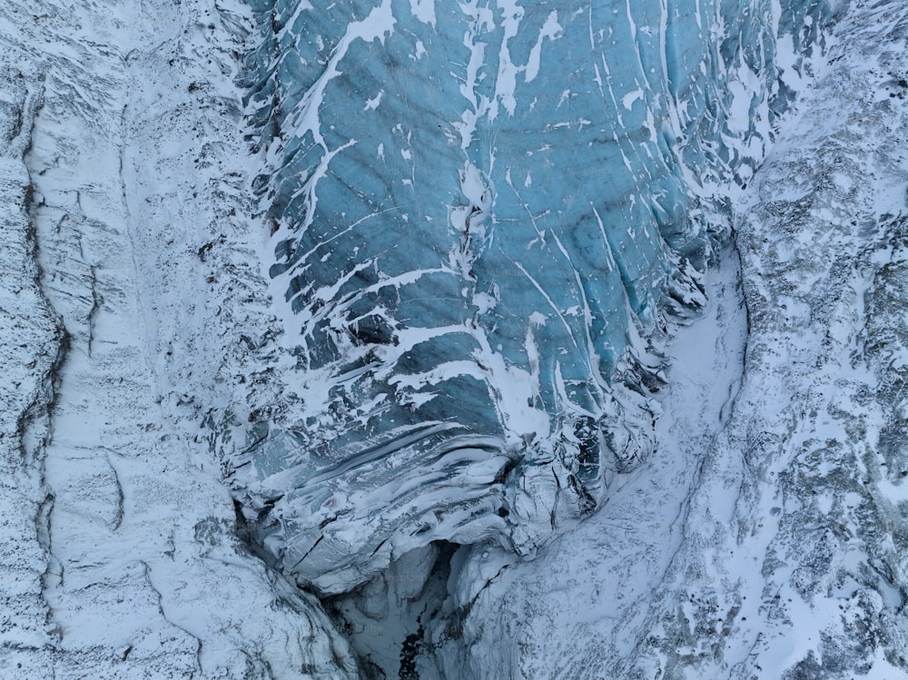an aerial view of a glacier in the snow