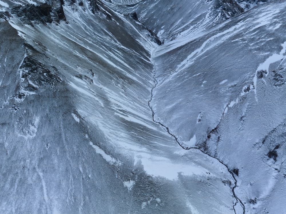 an aerial view of a snow covered mountain