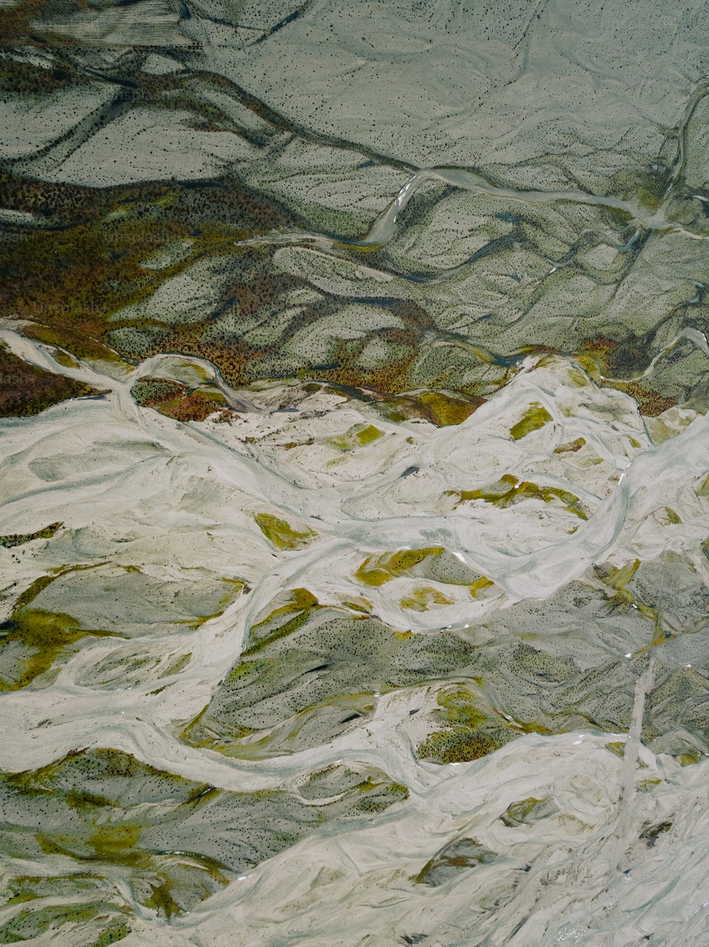 an aerial view of a snow covered mountain