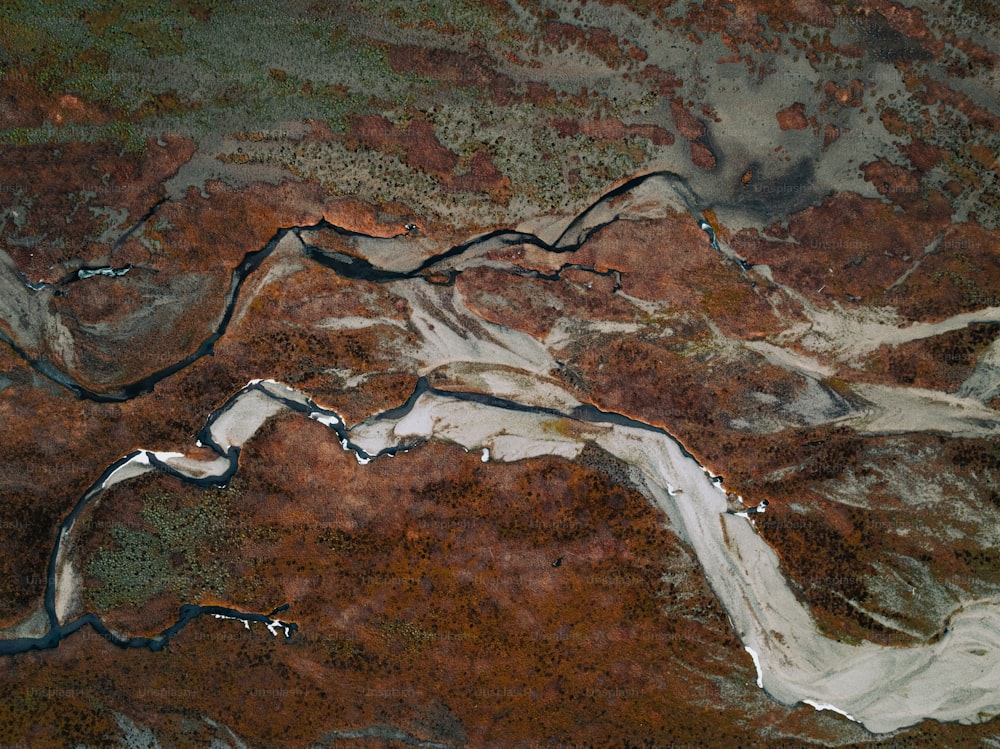 an aerial view of a river running through a valley