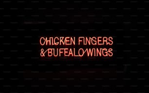 a neon sign that says chicken fingers and buffalo wings