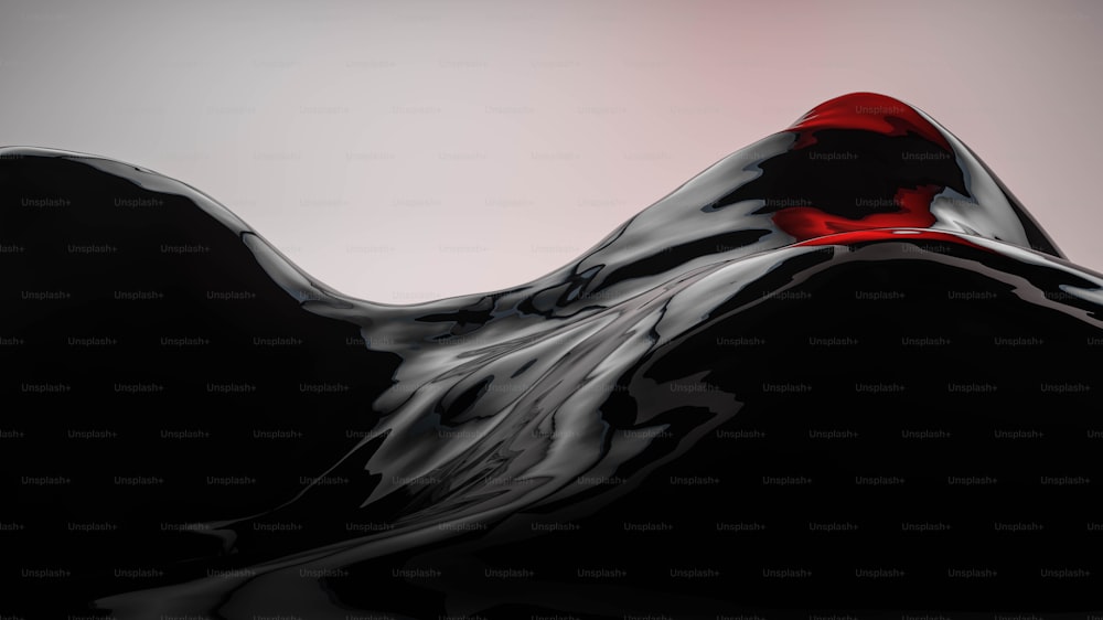 Un objeto negro y rojo con un fondo blanco