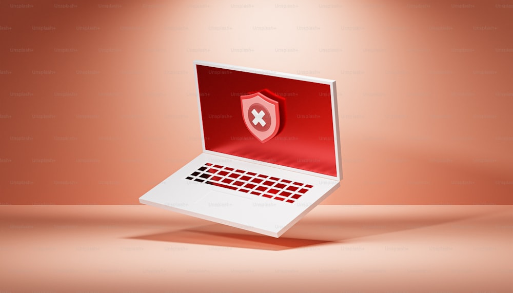 un portátil con un escudo rojo en la pantalla
