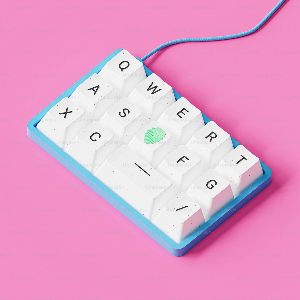 um teclado azul e branco em um fundo rosa