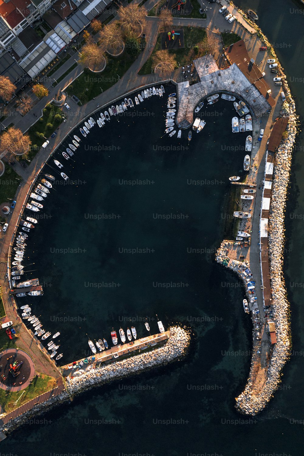 an aerial view of a marina with boats in it