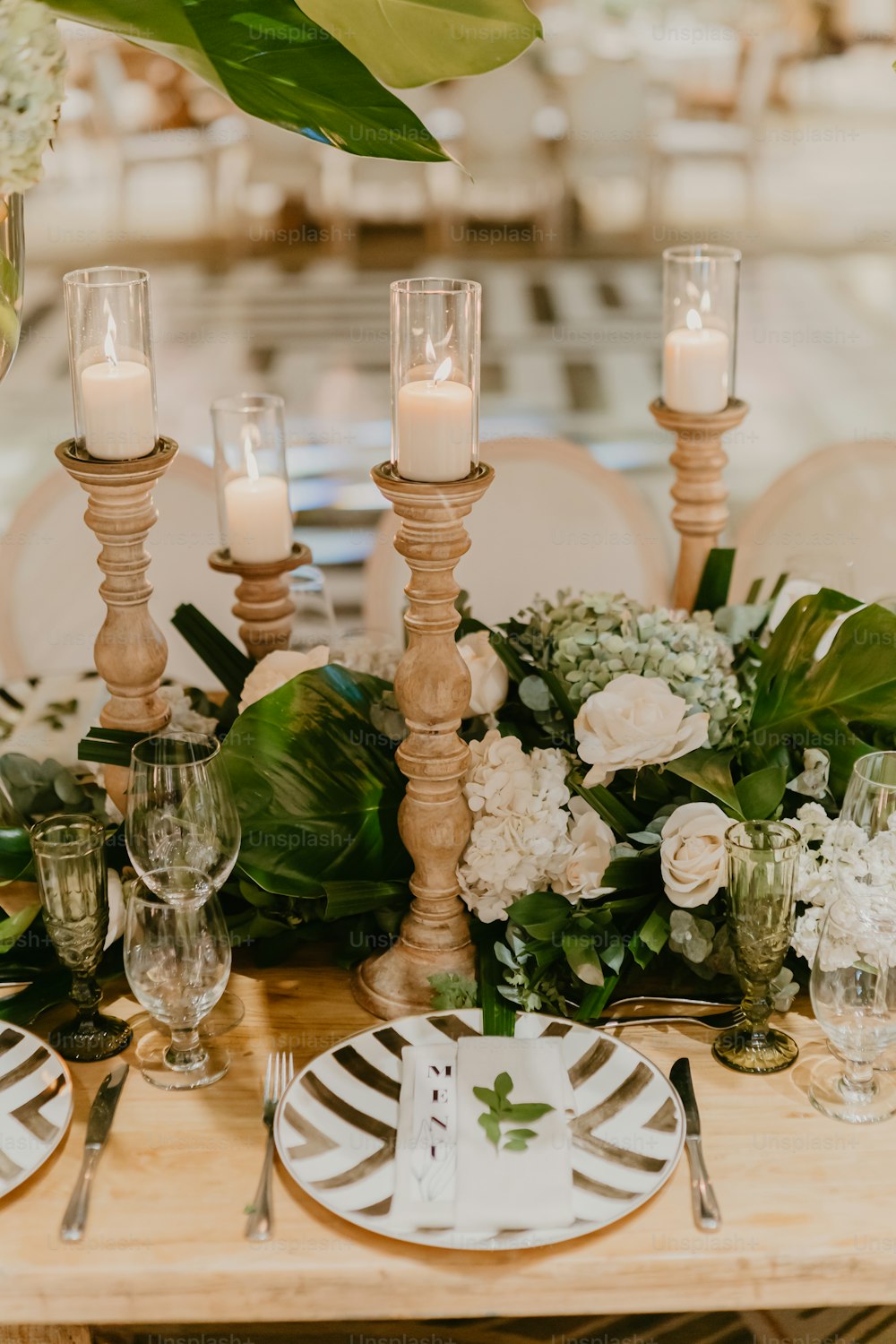 a wooden table topped with lots of white flowers