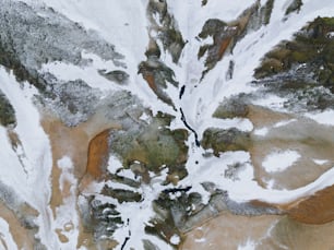 an aerial view of a snow covered mountain