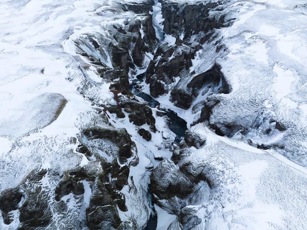 an aerial view of a snow covered mountain