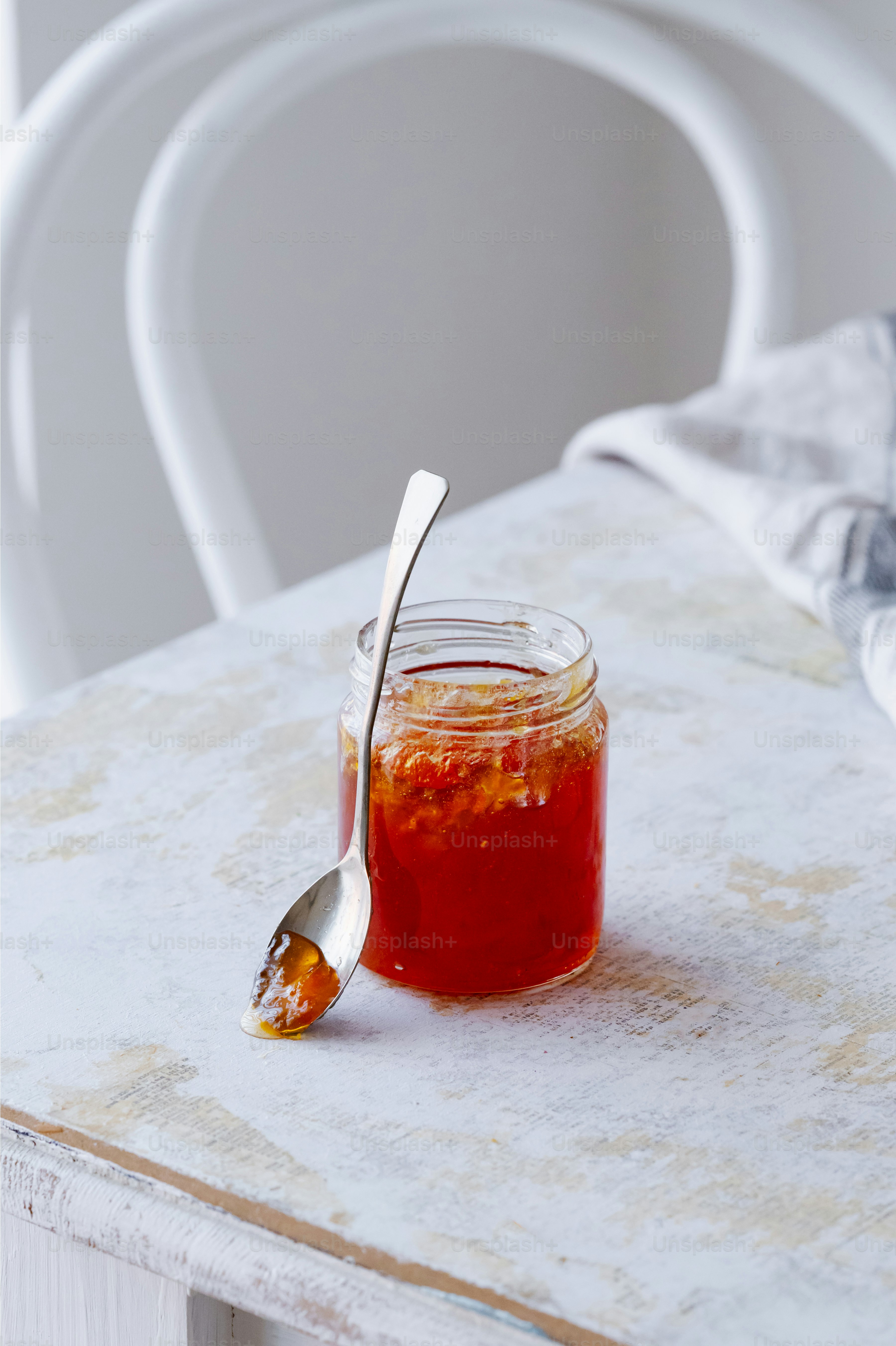 a spoon is sitting next to a jar of food