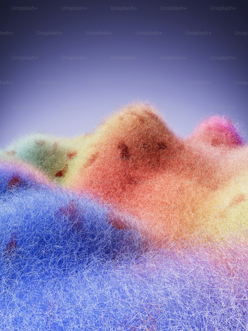 a multicolored image of a mountain with a blue sky in the background