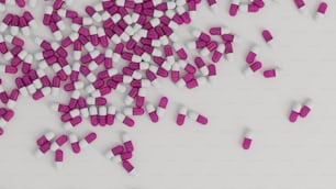 a pile of pills sitting on top of a white table