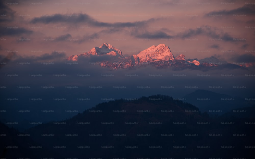 a view of a mountain range at sunset