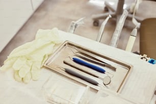 a table with a tray of surgical instruments on it