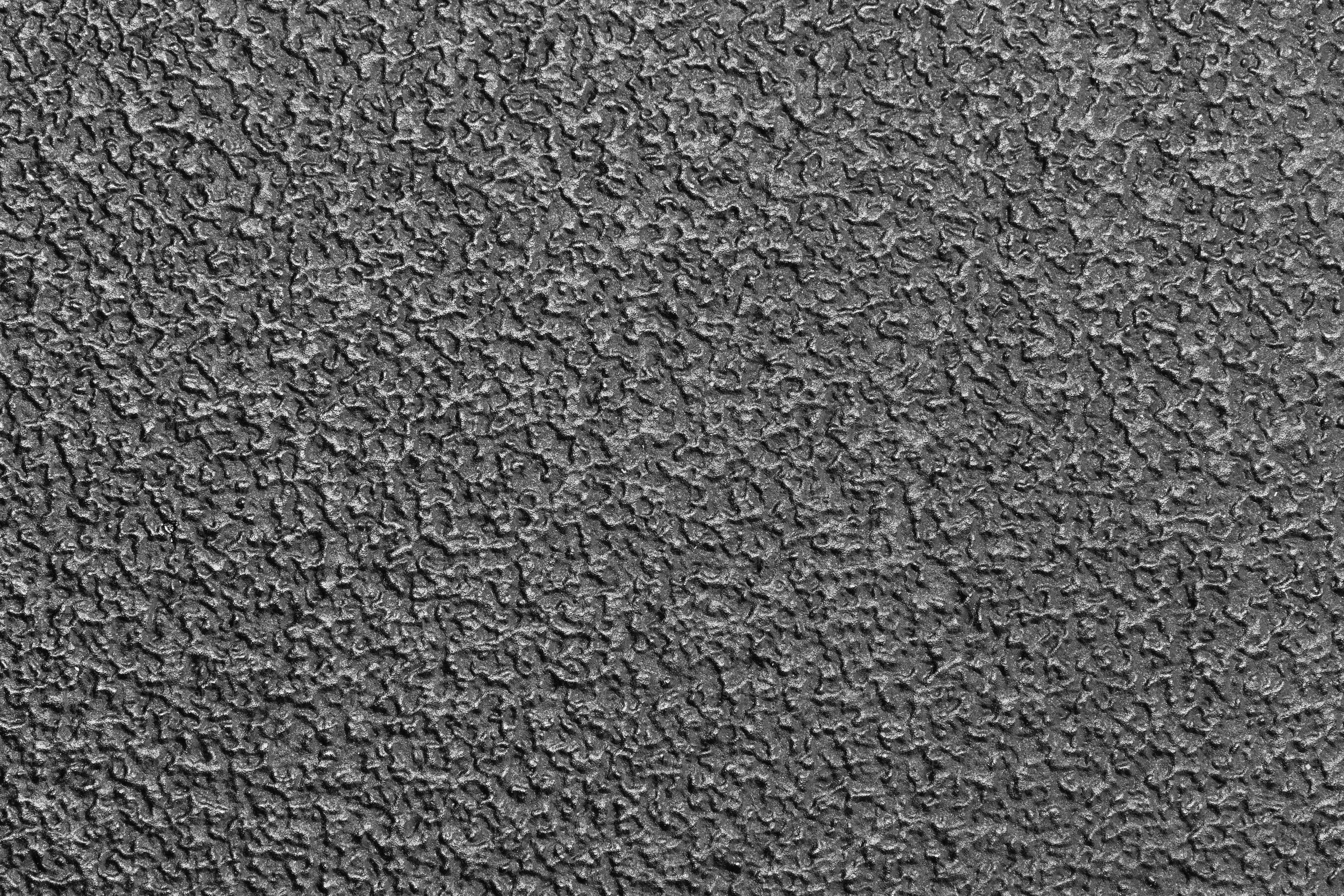 uma foto em preto e branco de uma superfície texturizada