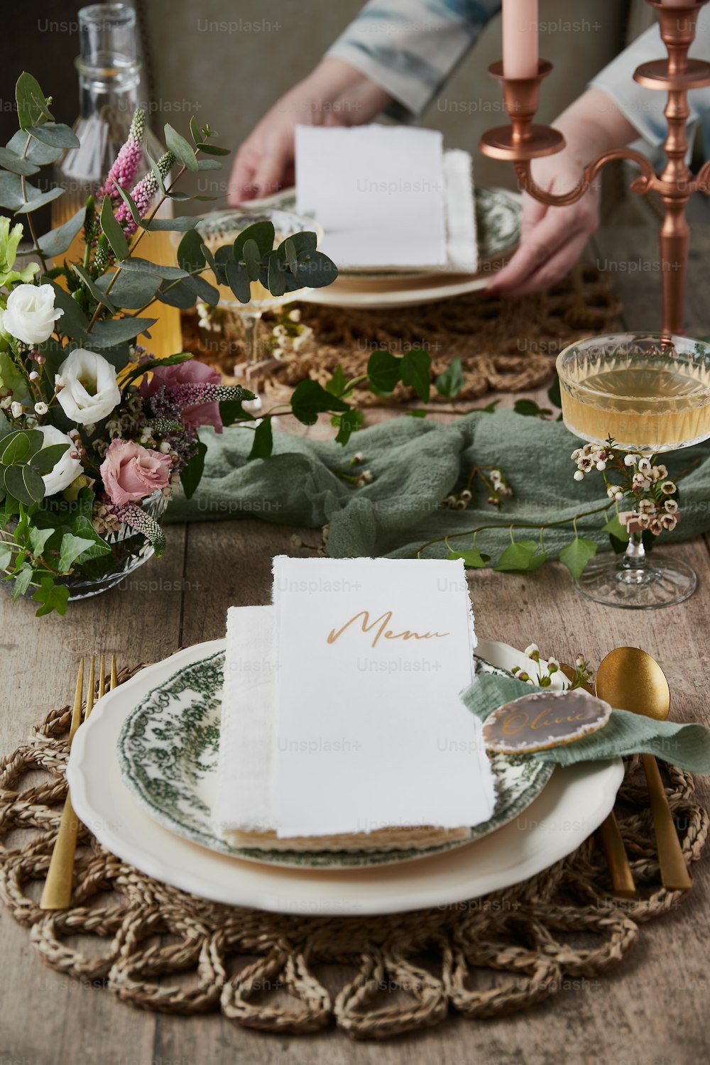 a place setting with place settings and place cards