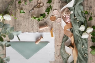 a piece of paper on a wooden table with flowers