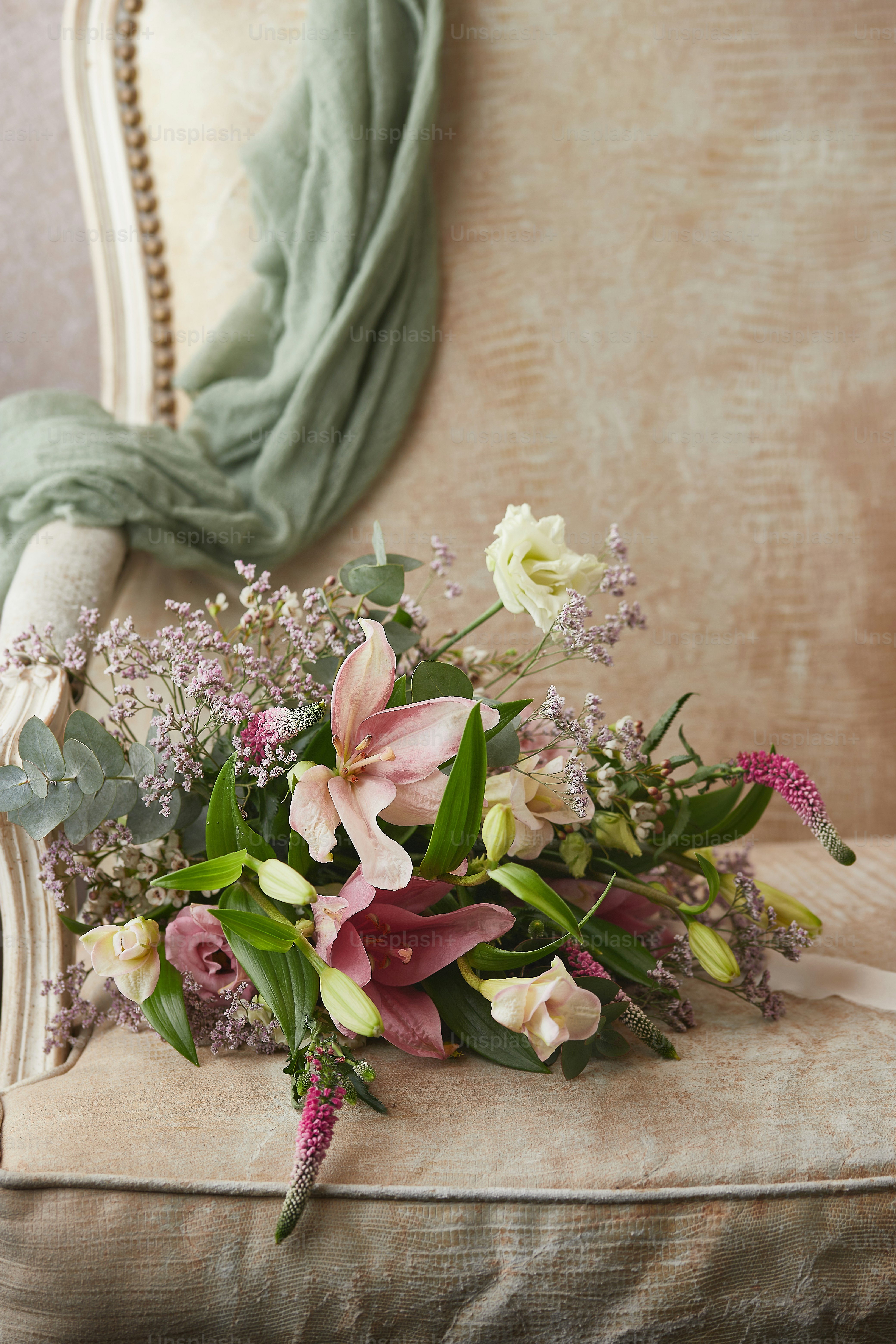 a bouquet of flowers sitting on top of a chair