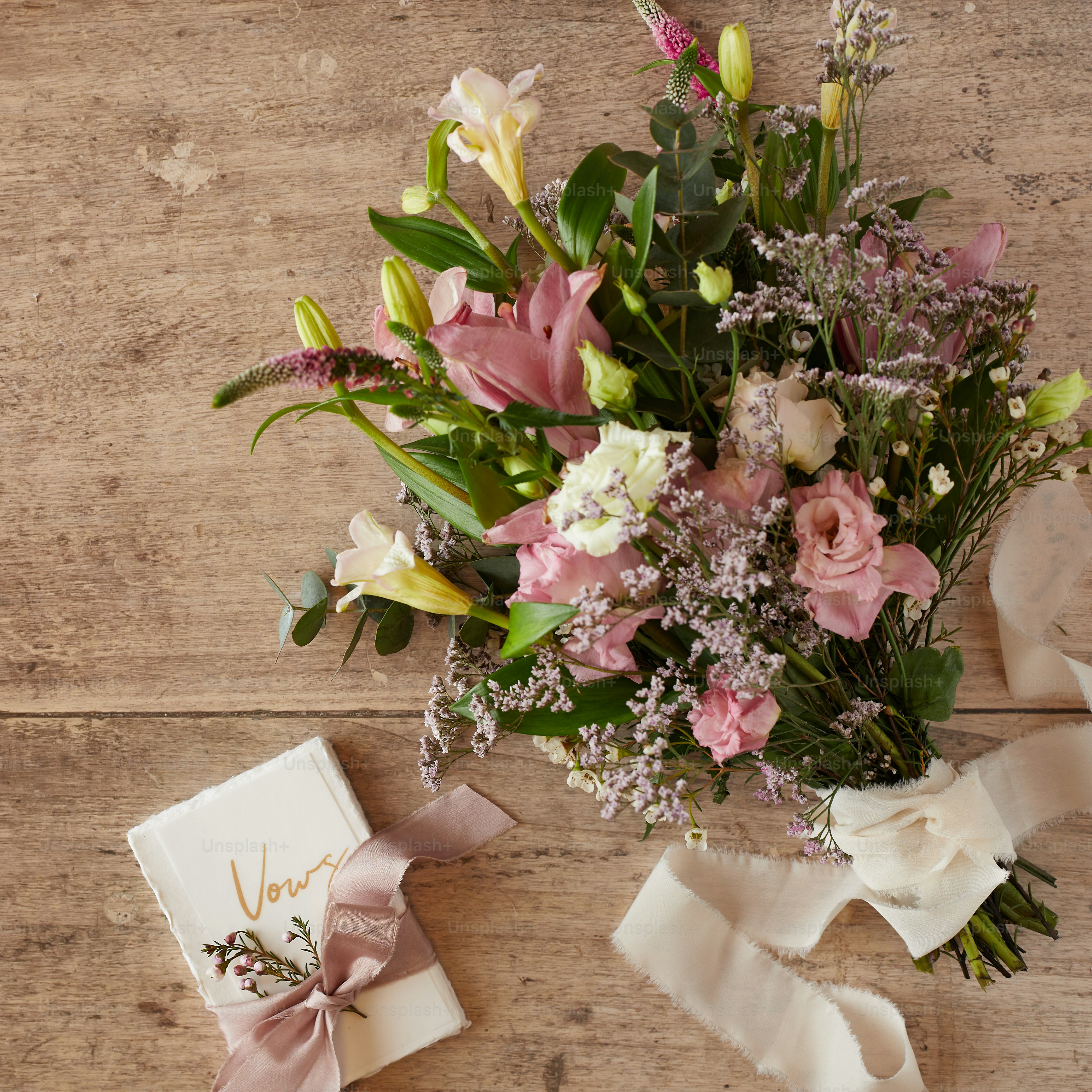 a bouquet of flowers sitting on top of a wooden table