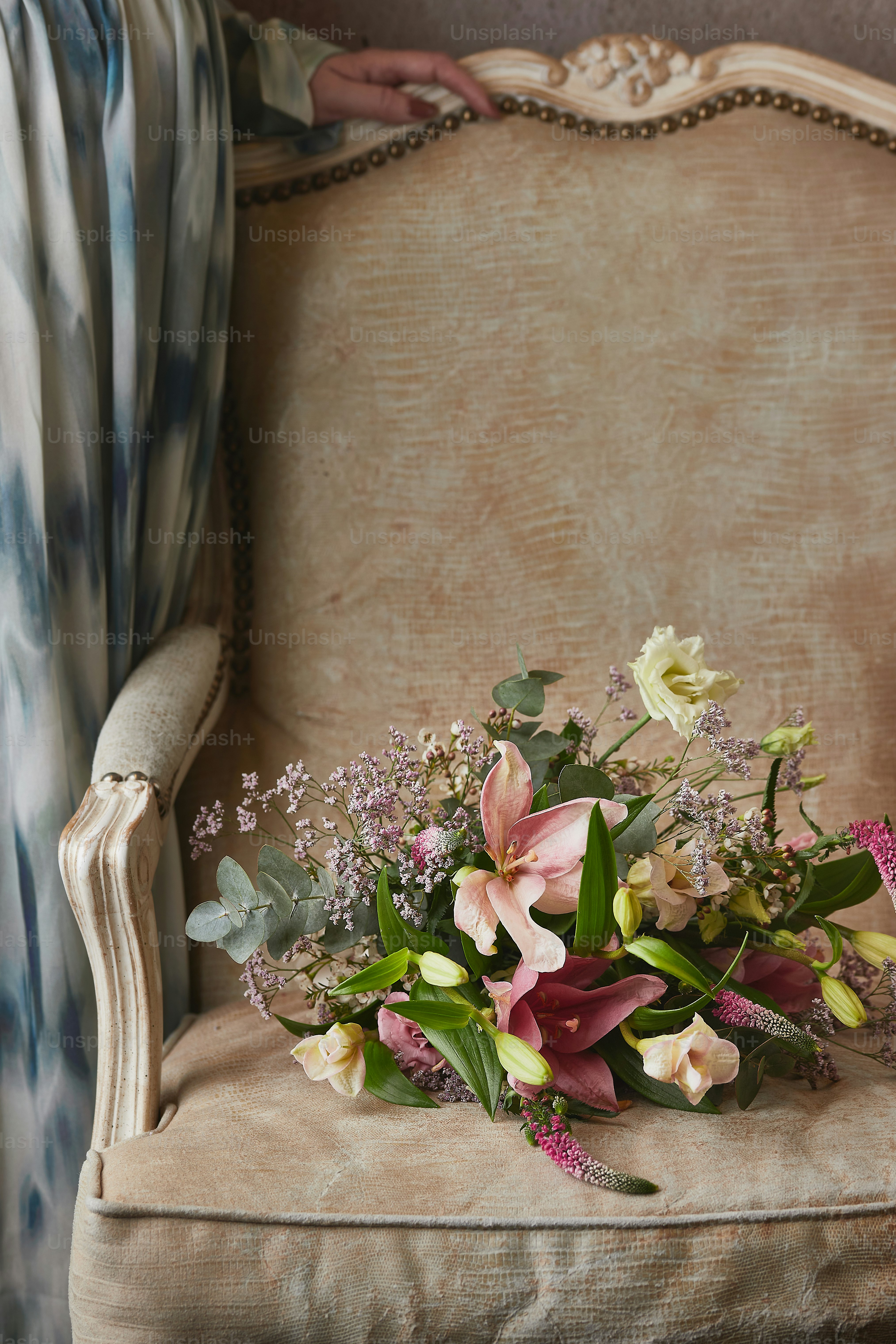 a bouquet of flowers sitting on top of a chair