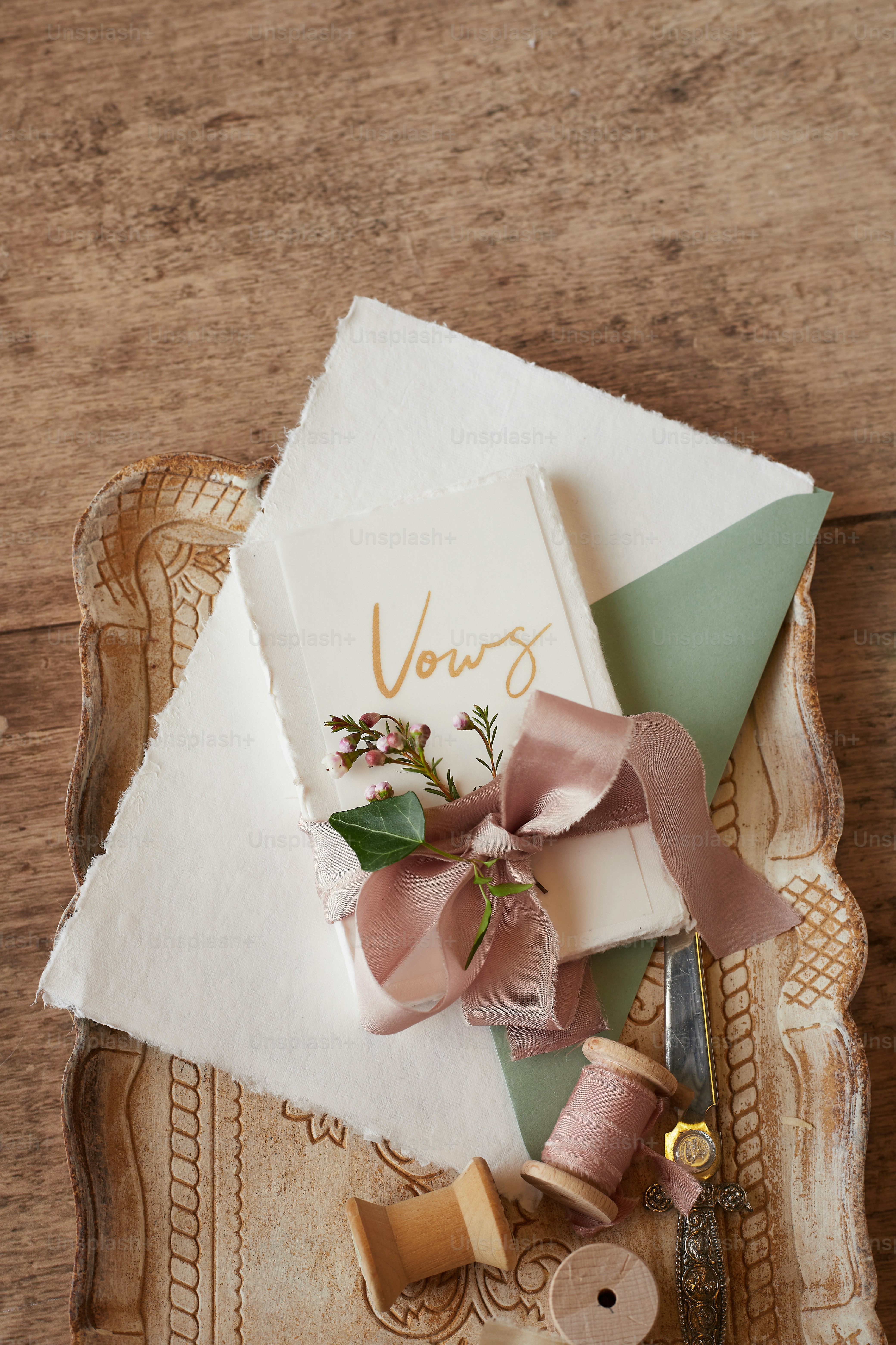 a table topped with a book and a pair of scissors