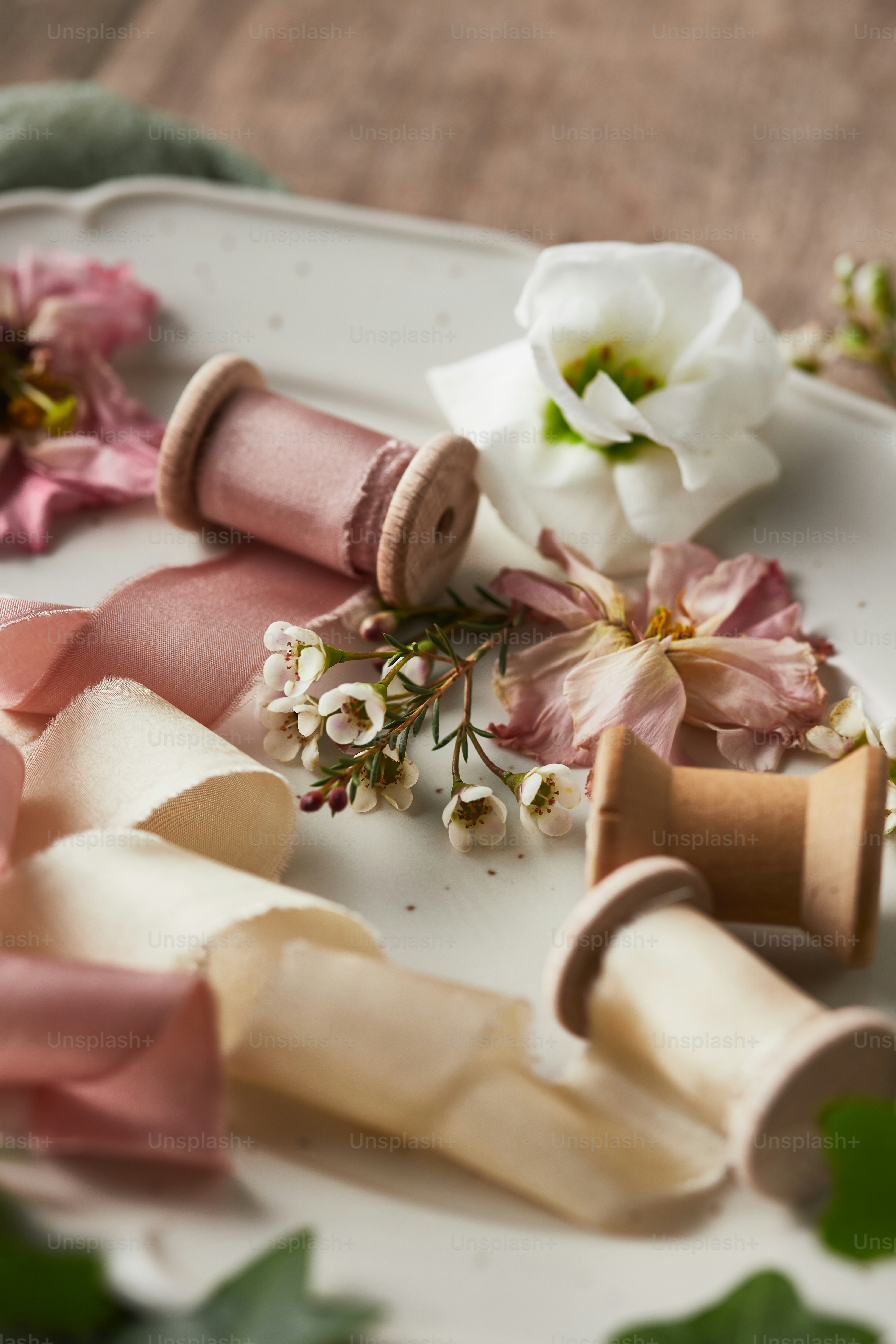 a white plate topped with pink and white flowers