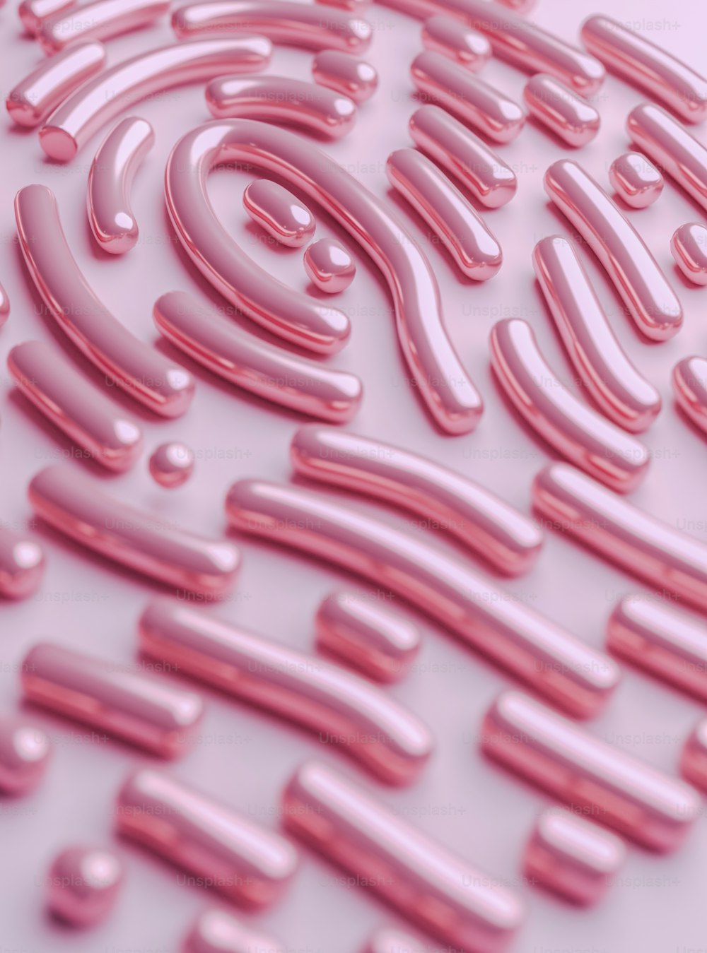 a close up of a pink pattern on a white surface