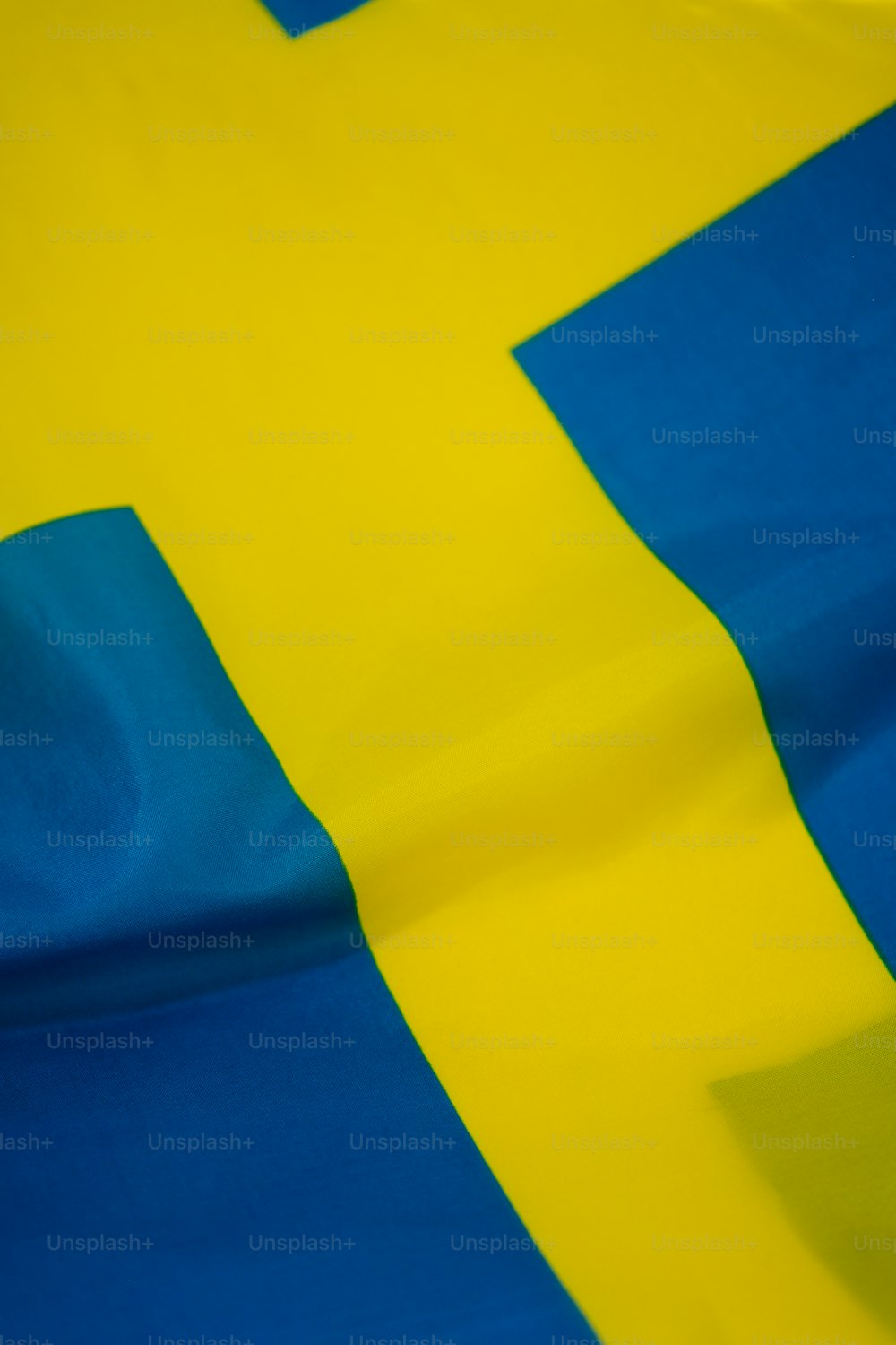 a close up of a yellow and blue flag