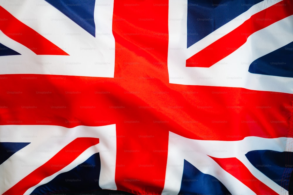 a red white and blue flag with a black background