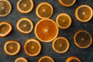 an orange sliced in half sitting on top of a table